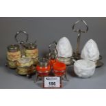 Collection of cruets on silver plated stands to include; Coalport, Locke & Co Worcester and orange