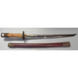 Modern reproduction Japanese Kantana short sword with metal mounted scabbard and simulated ivory