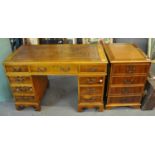 Reproduction good quality yew wood knee hole desk having leather inset top above three drawers to