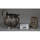 Indian silver matchbox cover, together with an Indian silver milk jug, 4 troy ozs approx. (B.P.