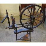 Stained vintage spinning wheel with treadle base. (B.P. 21% + VAT)