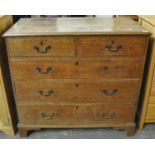 19th Century oak straight front chest of two short and three long drawers on a projecting base