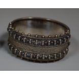Victorian white metal repousse decorated cuff bangle. (B.P. 21% + VAT)