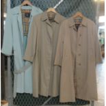 Three vintage ladies macs/raincoats, two beige, one powder blue, all have Burberrys labels, one
