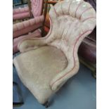 Late Victorian button back foliate upholstered nursing chair having serpentine front on cabriole