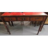 19th Century stained mahogany desk having leather inset top above three fitted drawers standing on