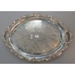 Heavy silver plated oval two handled tray with cast foliate and scrollwork border and engraved