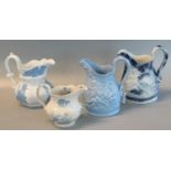 Ynysmeudwy Pottery, relief moulded, cherub design pale blue baluster shaped jug, unmarked. 20cm high