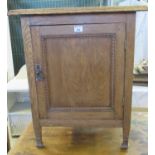 Edwardian oak single door blind panelled cupboard on tapering legs, together with another smaller