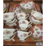 A tray of Paragon 'Honiton' fine bone china teaware, swag decorated in rose pink with floral