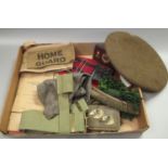 Box of military uniform items; buckles, belts, webbing, beret dated 1945 etc. Also including