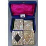 Three mother of pearl card cases and a mother of pearl purse in hard box. (B.P. 21% + VAT)