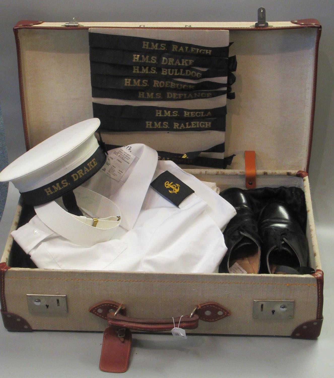 A suitcase containing naval officer's uniform items; cap, shoes etc, also a collection of naval