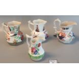 Group of four Swansea Pottery pouch shaped jugs, various, painted with flowers in Imari colours.