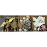 Three boxes of assorted items to include: a box of wooden, brass and other metal candlesticks, brass