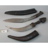 Nepalese Kukri with wooden grip and leather scabbard, together with a Middle Eastern Jambiya type