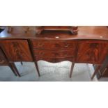 Edwardian style mahogany inlaid serpentine front sideboard on square tapering legs and spade