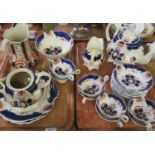Two trays of 19th Century Gaudy Welsh 'Pinwheel' pattern china to include: eight teacups with eleven