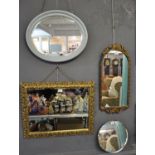 Four framed mirrors, oval with painted frame and bevel plate and pierced gilt frame with bevel