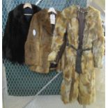 A multi-colour vintage fox fur belted coat with leather trim, a black fur jacket and a rabbit fur