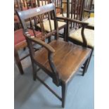 Early 19th Century oak farmhouse open arm elbow chair on square tapering legs. (B.P. 21% + VAT)