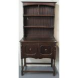 Early 20th Century oak two stage rack back barley twist dresser of narrow proportions in Jacobean