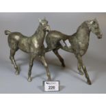 Two similar silver finish metal horses. (2) (B.P. 21% + VAT)
