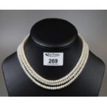 Three strand pearl necklace with 14ct gold clasp. (B.P. 21% + VAT)