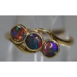 18ct gold three stone black opal doublet ring. Ring size N. Approx weight 2.7 grams. (B.P. 21% +