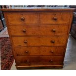 Large Victorian walnut straight front of two short and four long drawers with turned knob handles,