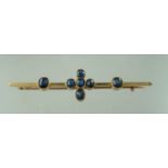 An Edwardian 15ct gold and sapphire bar brooch. Width 61mm. Approx weight 4.1 grams. (B.P. 21% +