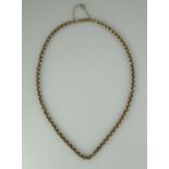 A Victorian 9ct gold chain with barrel clasp and safety chain. Length 17 inches (43cm). Approx