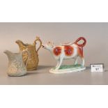 19th Century Swansea pottery red and white cow creamer with separate lid and gilded decoration on