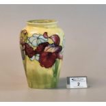 Mid 20th Century Moorcroft art pottery tube lined vase on a yellow ground decorated with irises,