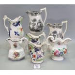 A group of Welsh pottery dresser jugs to include; graduated set of three Swansea Gaudy Flower in