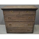 West African carved hardwood straight fronted chest of two short and three long drawers with brass