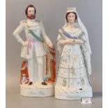 Companion pair of 19th Century Staffordshire pottery flat backed figures; 'Queen of England' and '