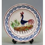 Welsh Llanelly pottery cockerel plate with sponged border and painted decoration. 25cm diameter