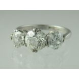 Platinum and diamond three stone ring. The old cut diamonds an estimated 2cts in total. Ring size N.