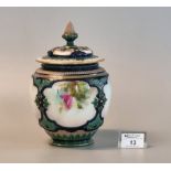 Royal Worcester porcelain baluster jar and pierced cover, the panels hand painted with roses and