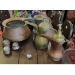 Collection of Middle Eastern copper and brass items to include; three Dallahs, large beaten copper