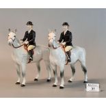 Two Beswick huntswomen on dapple grey horses, ladies with black hat, jacket and yellow trousers with