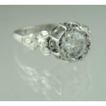 A diamond solitaire ring set in 18ct white gold and platinum. The old cut diamond an estimated 0.