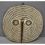 Spectacular West African polychrome decorated carved hardwood circular shaped owl mask. Mali/Burkino