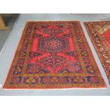 Middle Eastern design Viss on a red ground with mulit-coloured geometric flower head and other
