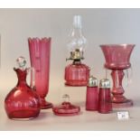 Collection of cranberry glass items to include; single handled chamber oil burner, baluster single