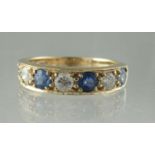 Sapphire and diamond half eternity style ring of four sapphires and three diamonds. Ring size S.