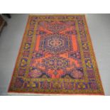 Burgundy ground old Persian geometric and foliate Bakhytar village rug. 220 x 160cm approx. (B.P.