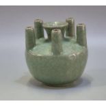 Chinese Guan style crackle green glazed stick neck baluster vase with five specimen stems around a