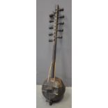 Small West African Kora stringed instrument with studded body and 10 tuning heads. (B.P. 21% + VAT)